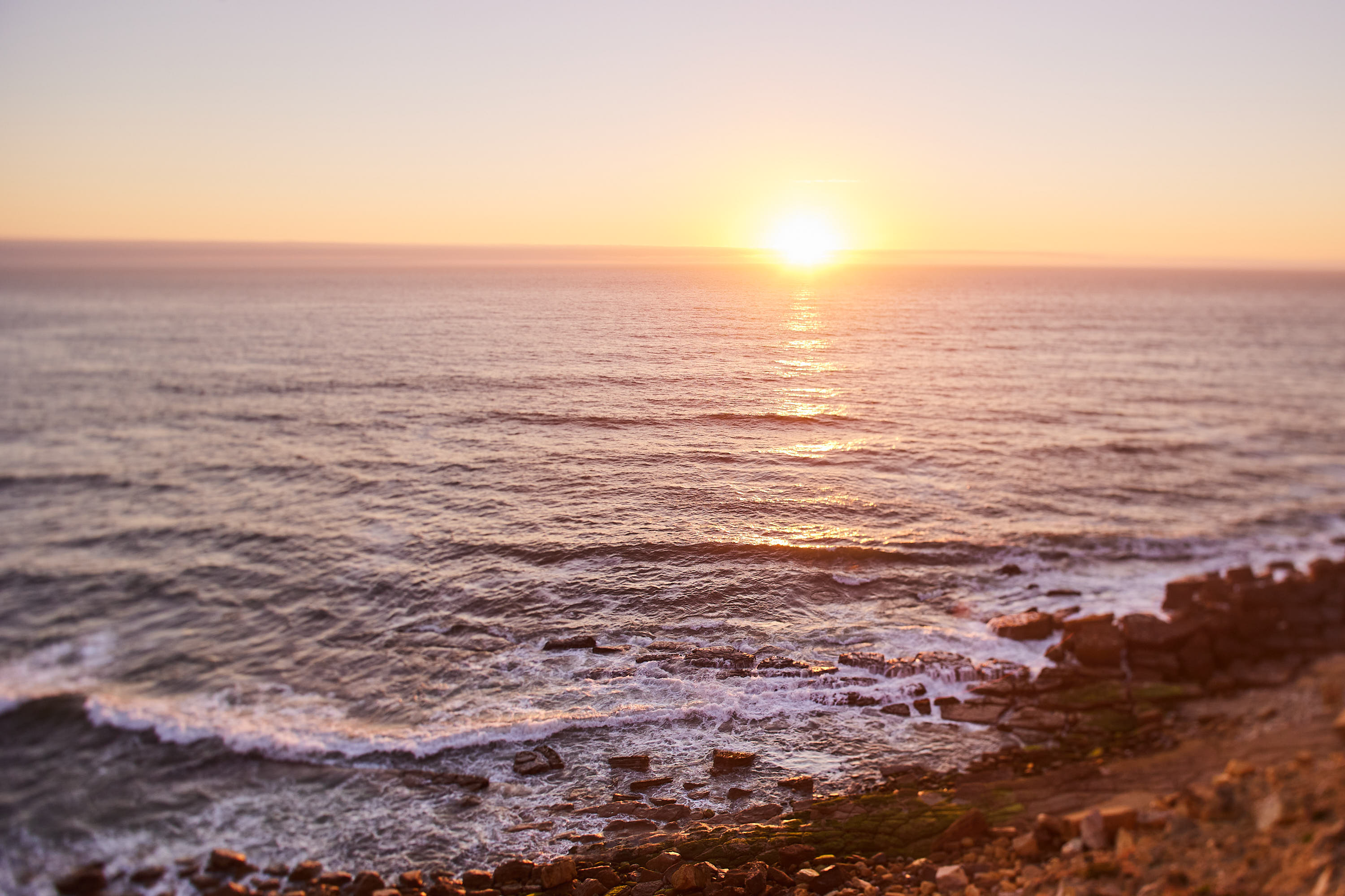 Golden sunset over the Atlantic ocean below Ocean's Garden